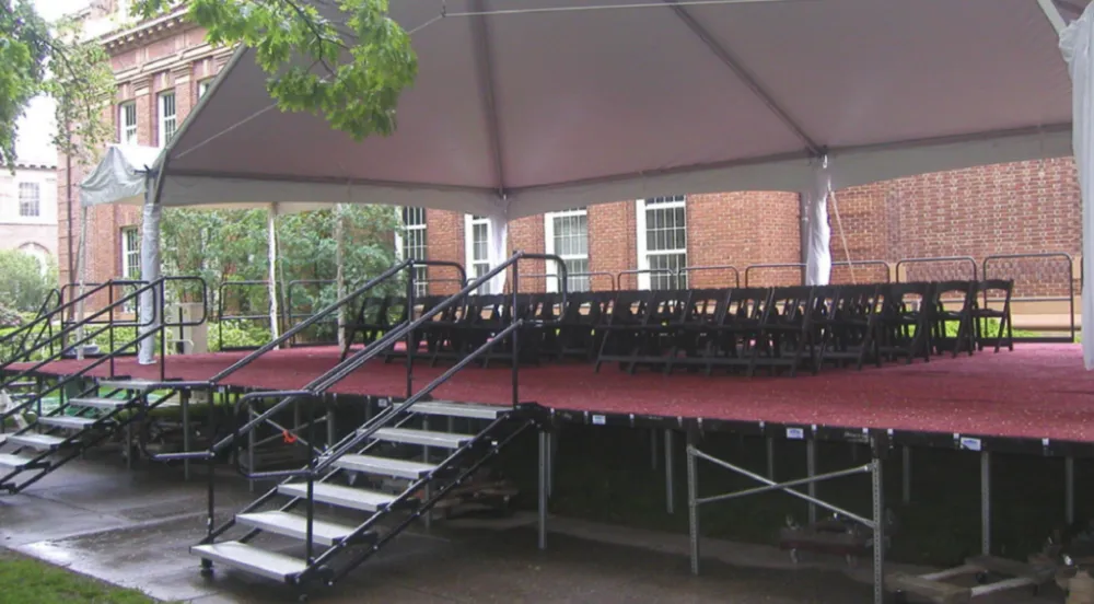 An event staging idea using multiple stair systems and a red floor.